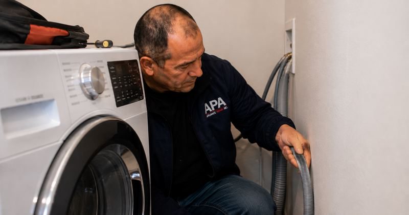 Kinked washing machine drain hose restricting water flow